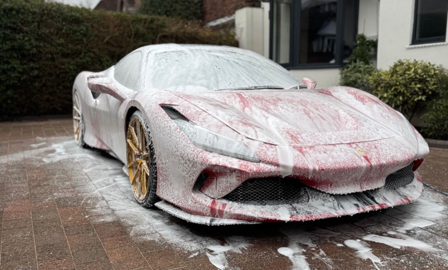 Ferrari F8 covered in snow foam during a mobile detail