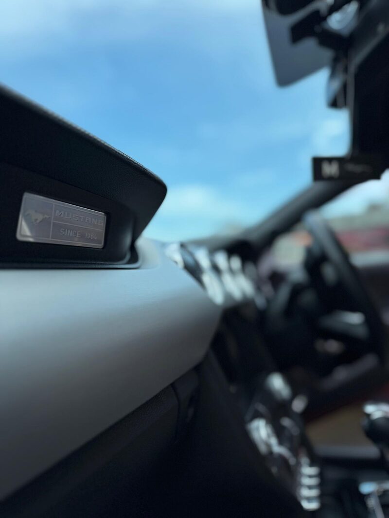 Ford Mustang dashboard badge after an interior detail by MV Detailing