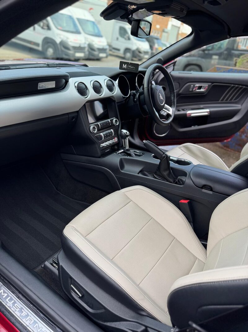 Ford Mustang interior with white leather detailed by MV Detailing