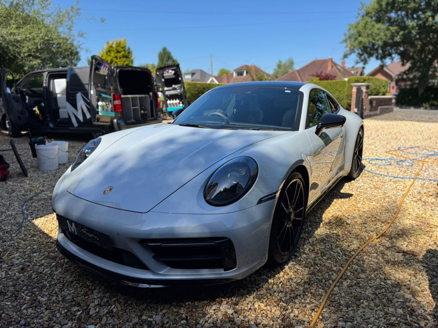 Porsche 911 GTS detailed at a customer home with the MV Detailing van